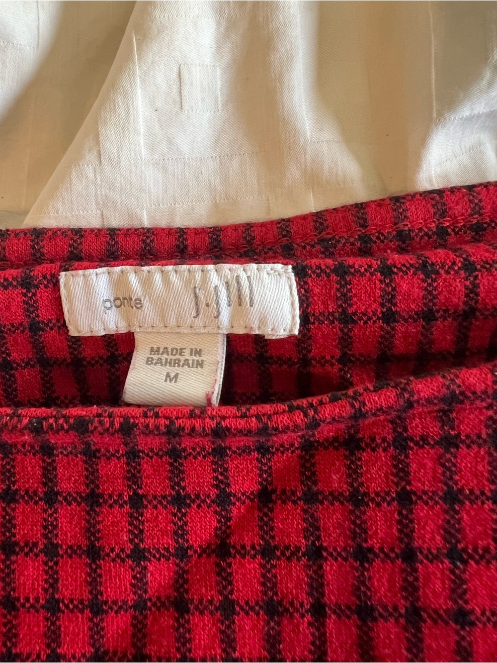 J Jill women’s shirt with cutting detail along the hip.